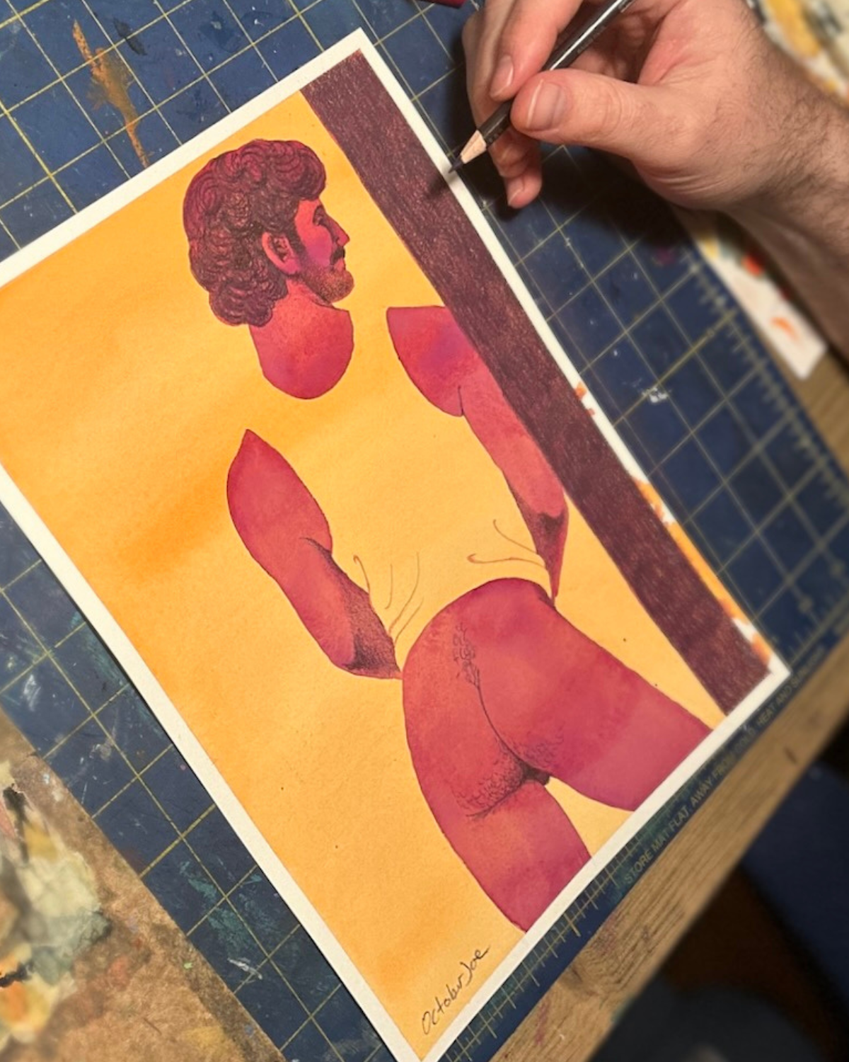 Watercolor painting of a semi-nude man leaning against a wall, against an orange background